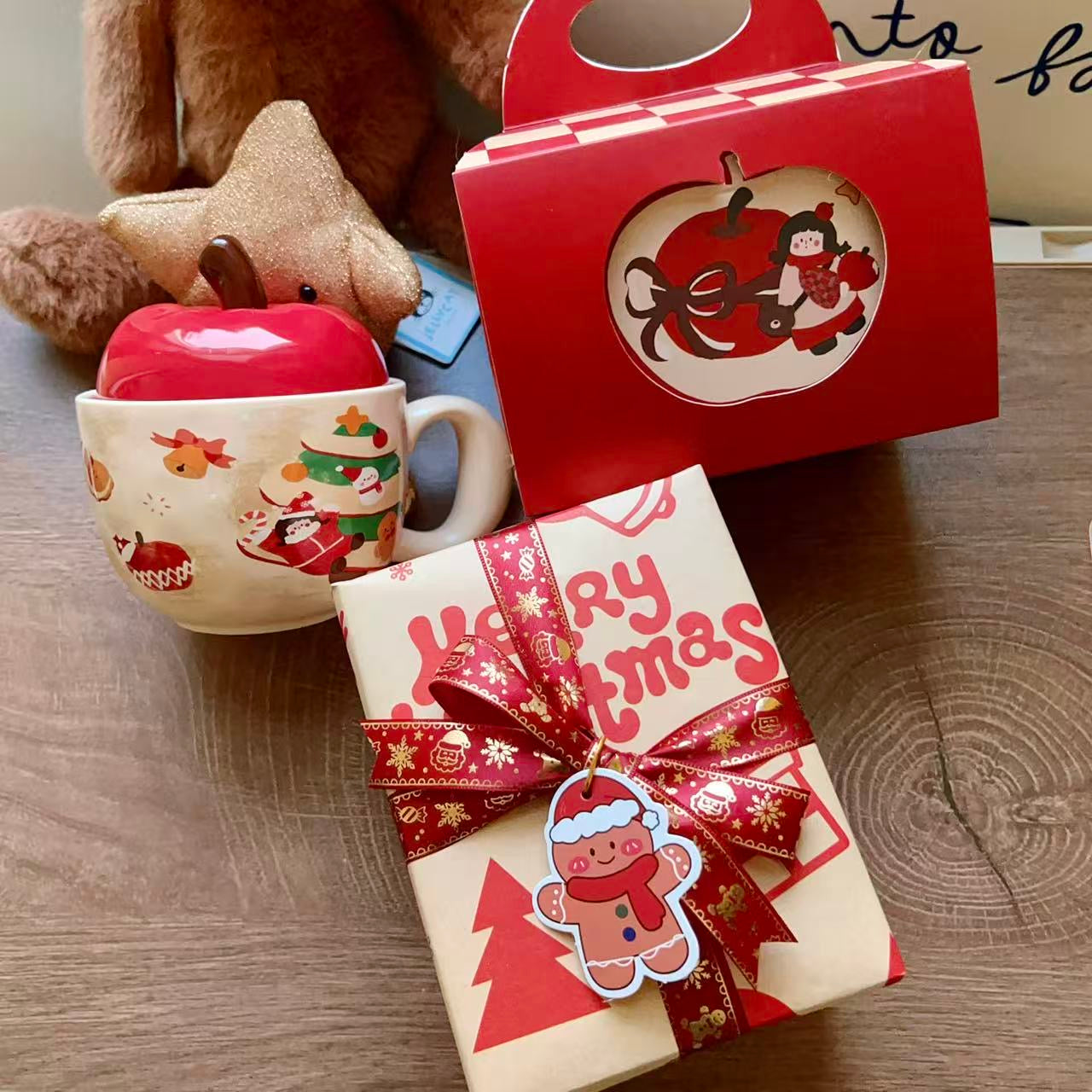 Christmas ceramic mugs with red apple lid showing gingerbread man and girl playing piano designs, 420ML
