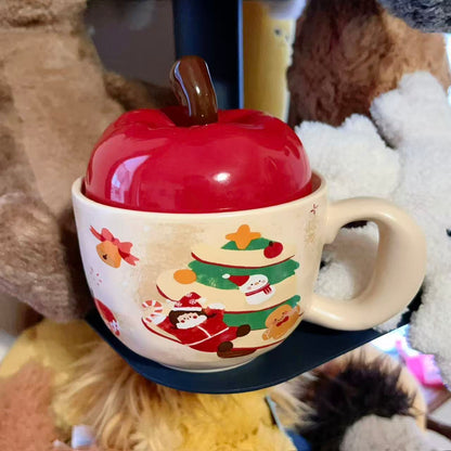 Christmas ceramic mugs with red apple lid showing gingerbread man and girl playing piano designs, 420ML