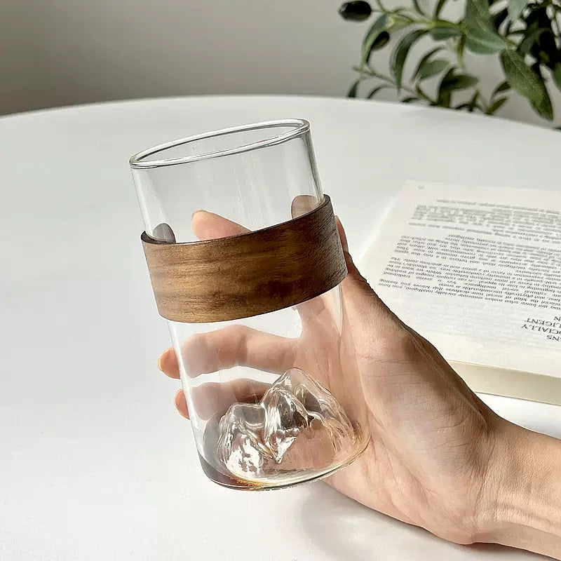 minimalist glass cup with natural wood band and 3D mountain base design