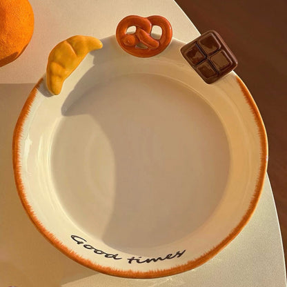 Hand-painted ceramic deep plate with salad showing 3D bread decorations: croissant, pretzel, chocolate, 21CM