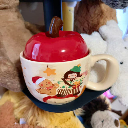 Christmas ceramic mugs with red apple lid showing gingerbread man and girl playing piano designs, 420ML