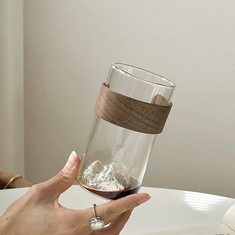minimalist glass cup with natural wood band and 3D mountain base design