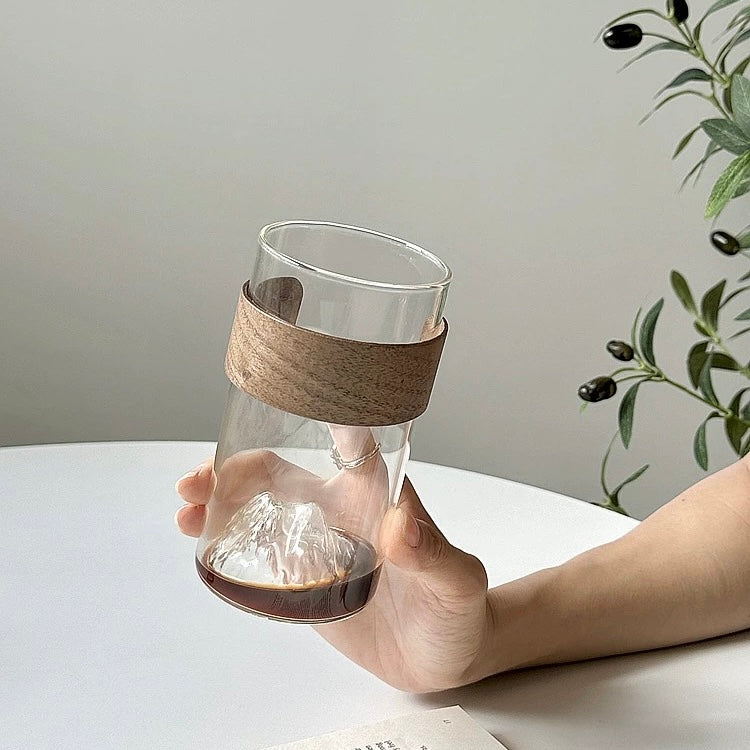 minimalist glass cup with natural wood band and 3D mountain base design