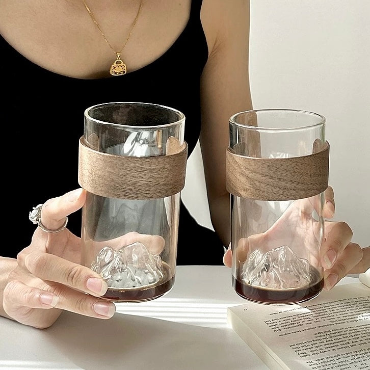 minimalist glass cup with natural wood band and 3D mountain base design