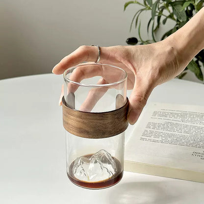 minimalist glass cup with natural wood band and 3D mountain base design