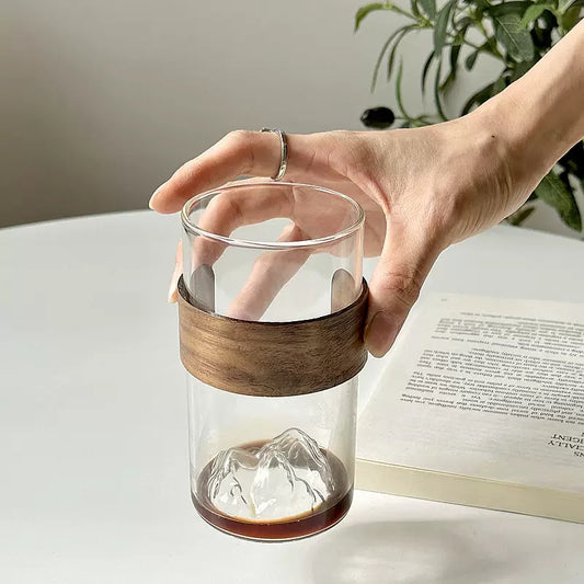 minimalist glass cup with natural wood band and 3D mountain base design
