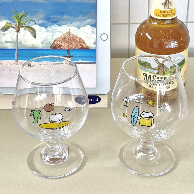 Surfing cat footed glass cups showing blue and yellow surfboard designs, 300ML