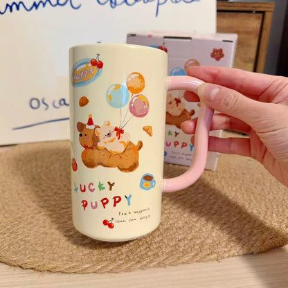 Mug with cartoon designs and text held by a hand on a textured surface
