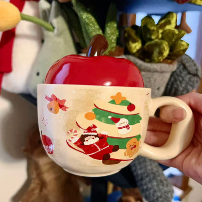 Christmas ceramic mugs with red apple lid showing gingerbread man and girl playing piano designs, 420ML