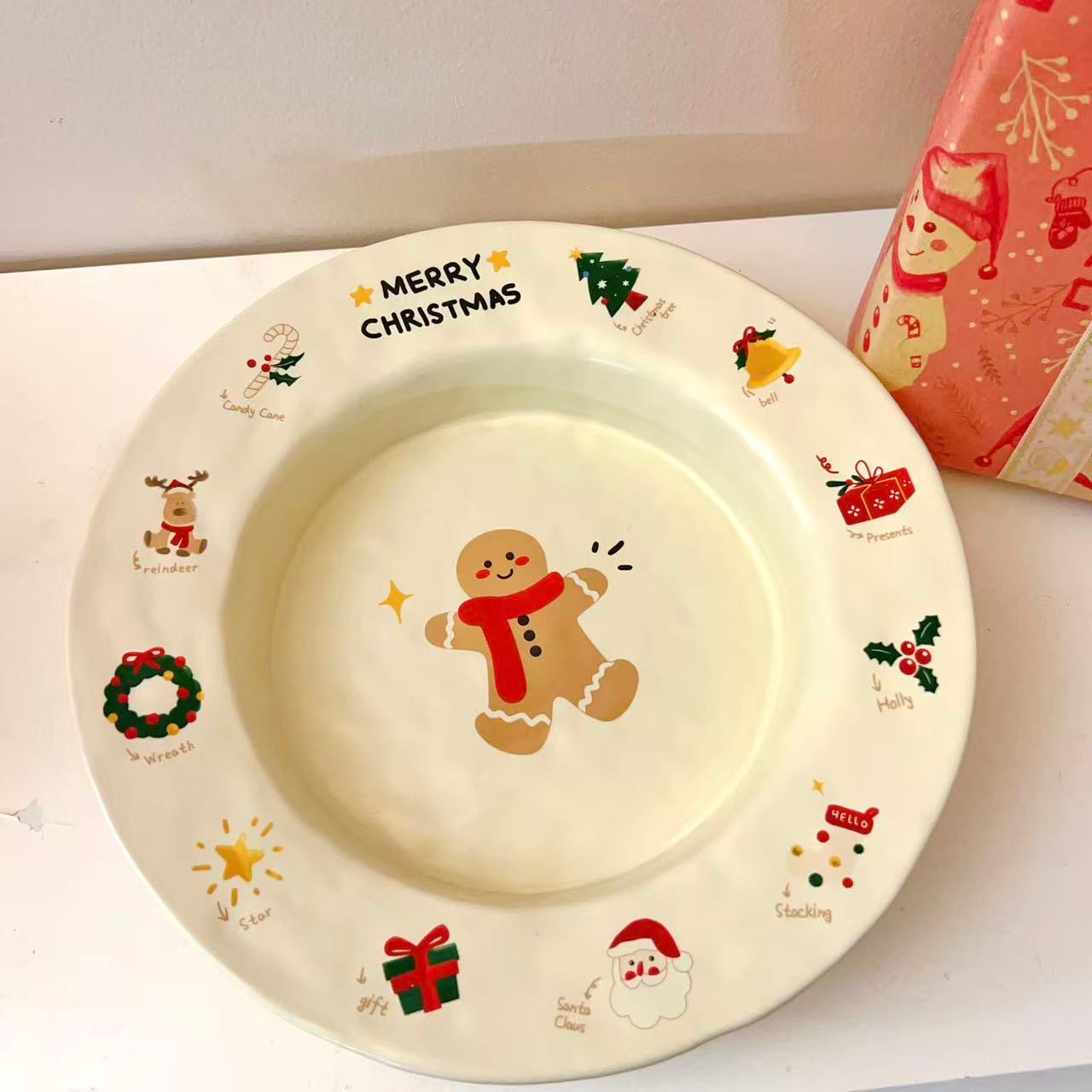 Christmas gingerbread man round plate with MERRY CHRISTMAS text and festive icons, 9 inches