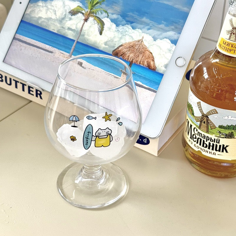 Surfing cat footed glass cups showing blue and yellow surfboard designs, 300ML