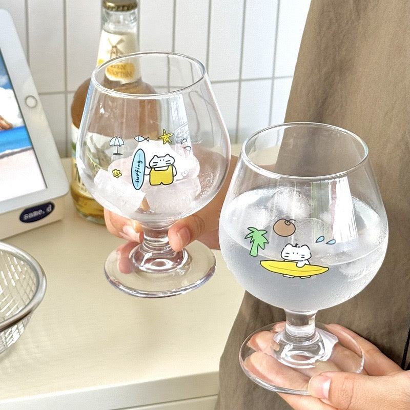 Surfing cat footed glass cups showing blue and yellow surfboard designs, 300ML