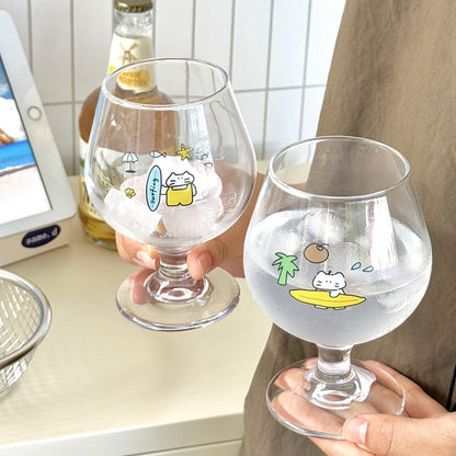 Surfing cat footed glass cups showing blue and yellow surfboard designs, 300ML