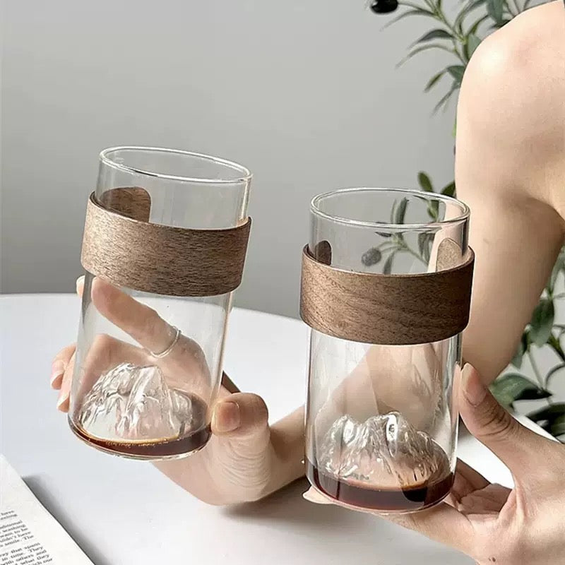 minimalist glass cup with natural wood band and 3D mountain base design